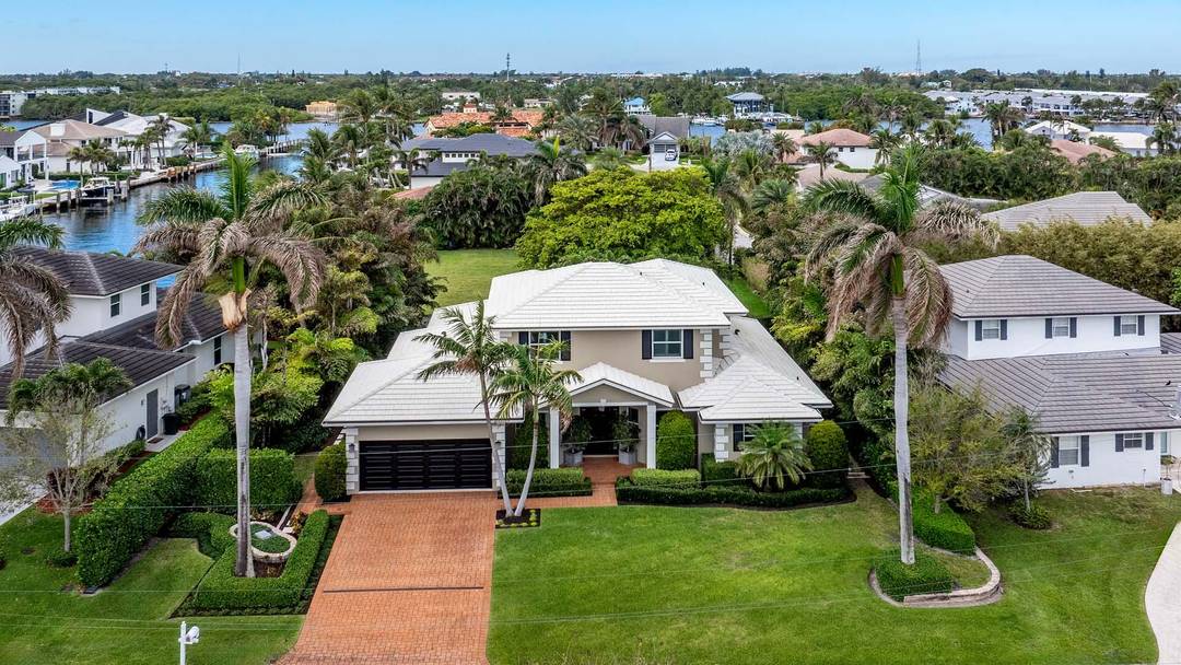 This exceptional Ocean Ridge residence, crafted by the renowned Varga Homes and completed in 2014, is a rare opportunity to own a masterpiece just two blocks from pristine beach access.
