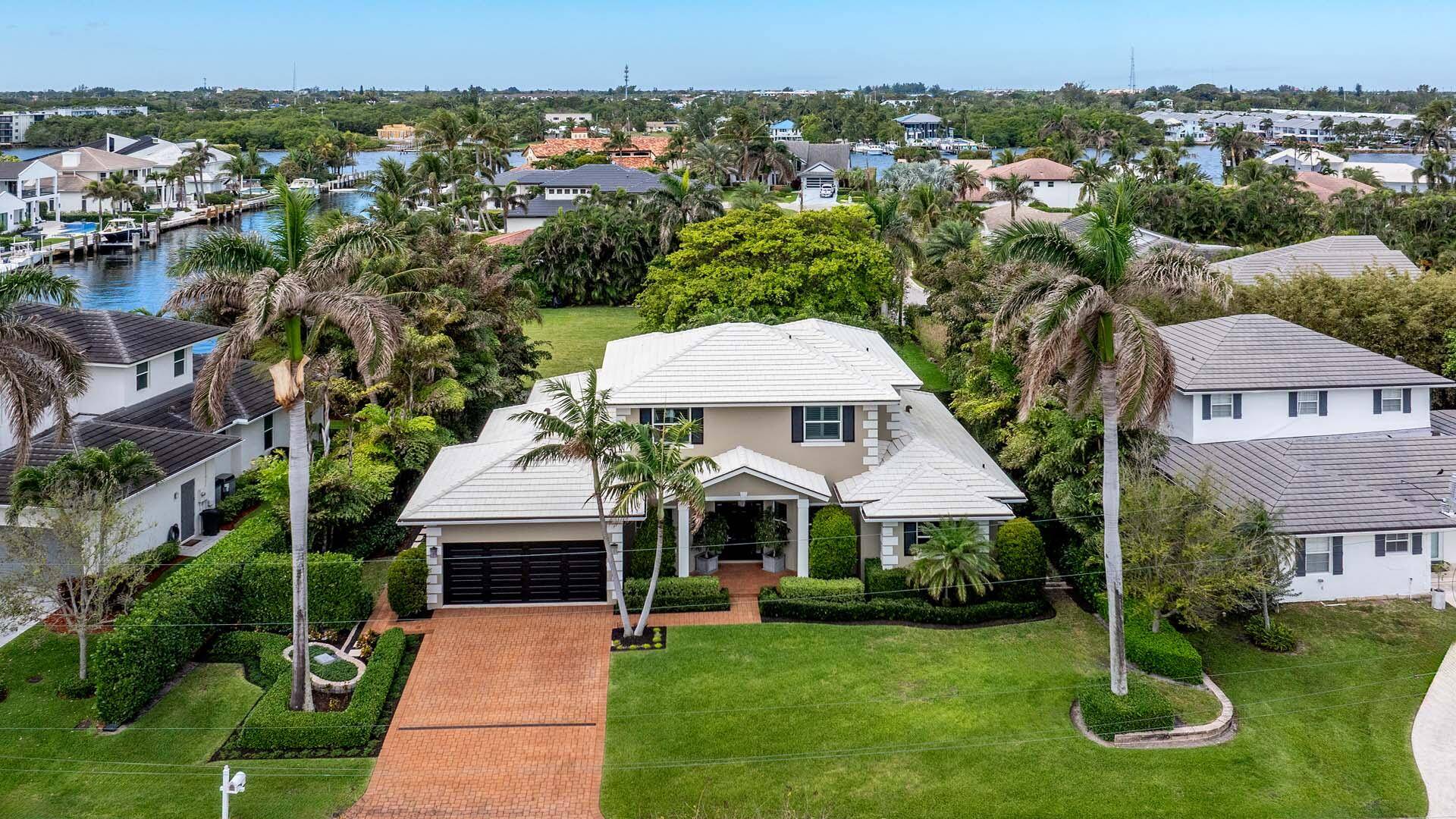 This exceptional Ocean Ridge residence, crafted by the renowned Varga Homes and completed in 2014, is a rare opportunity to own a masterpiece just two blocks from pristine beach access.