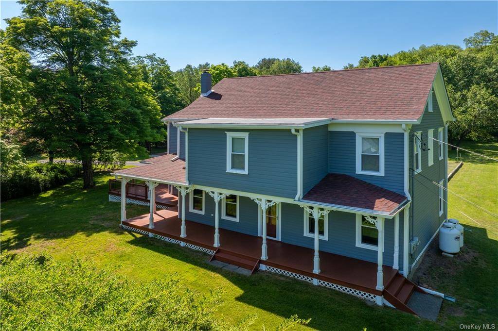 Charming light filled 2 family farmhouse on 2 park like acres.
