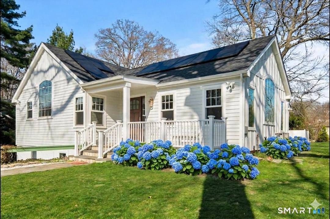 Welcome to 8 Ledge Road, a beautifully updated coastal home in the heart of Rowayton.