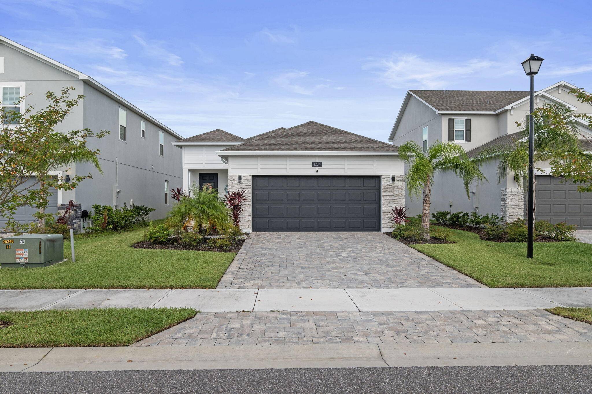 Newly Built in 2023, 3 2 2 Lake Front Home with many upgrades.
