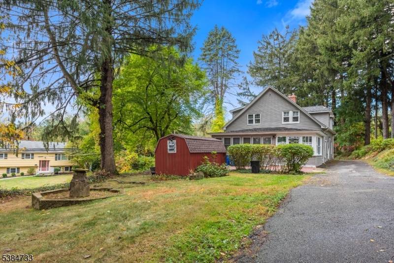 Welcome Home ! Charming Cape Cod timeless character, cozy covered front porch, leads to the great room, beautiful beamed ceilings, stunning stone fireplace, a perfect place for gatherings.