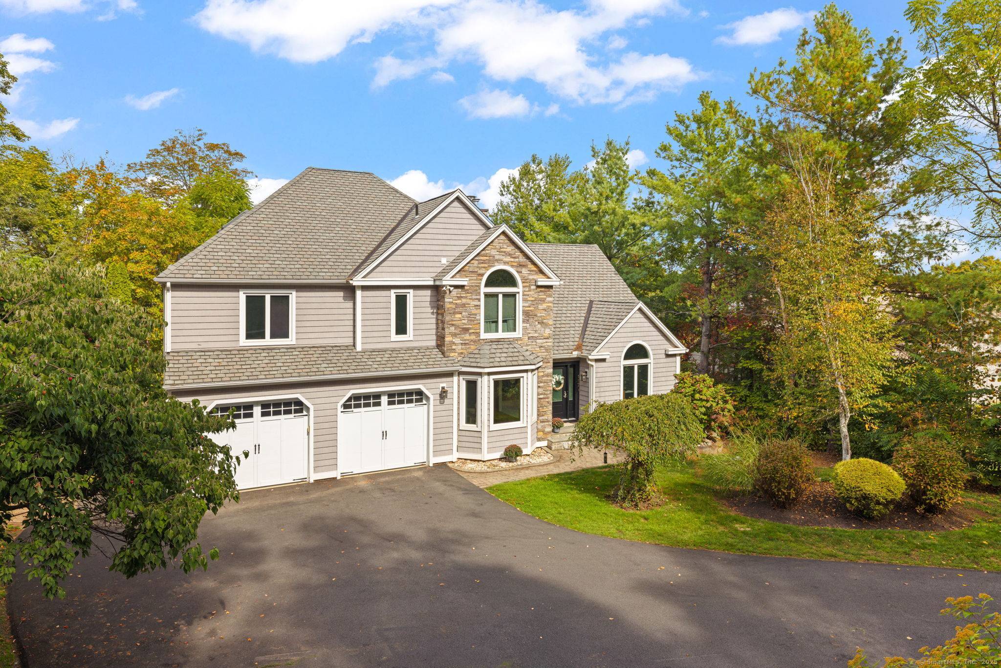 Welcome to 117 Old Wood Rd, a modern colonial style home offering a perfect blend of modern upgrades and classic charm.