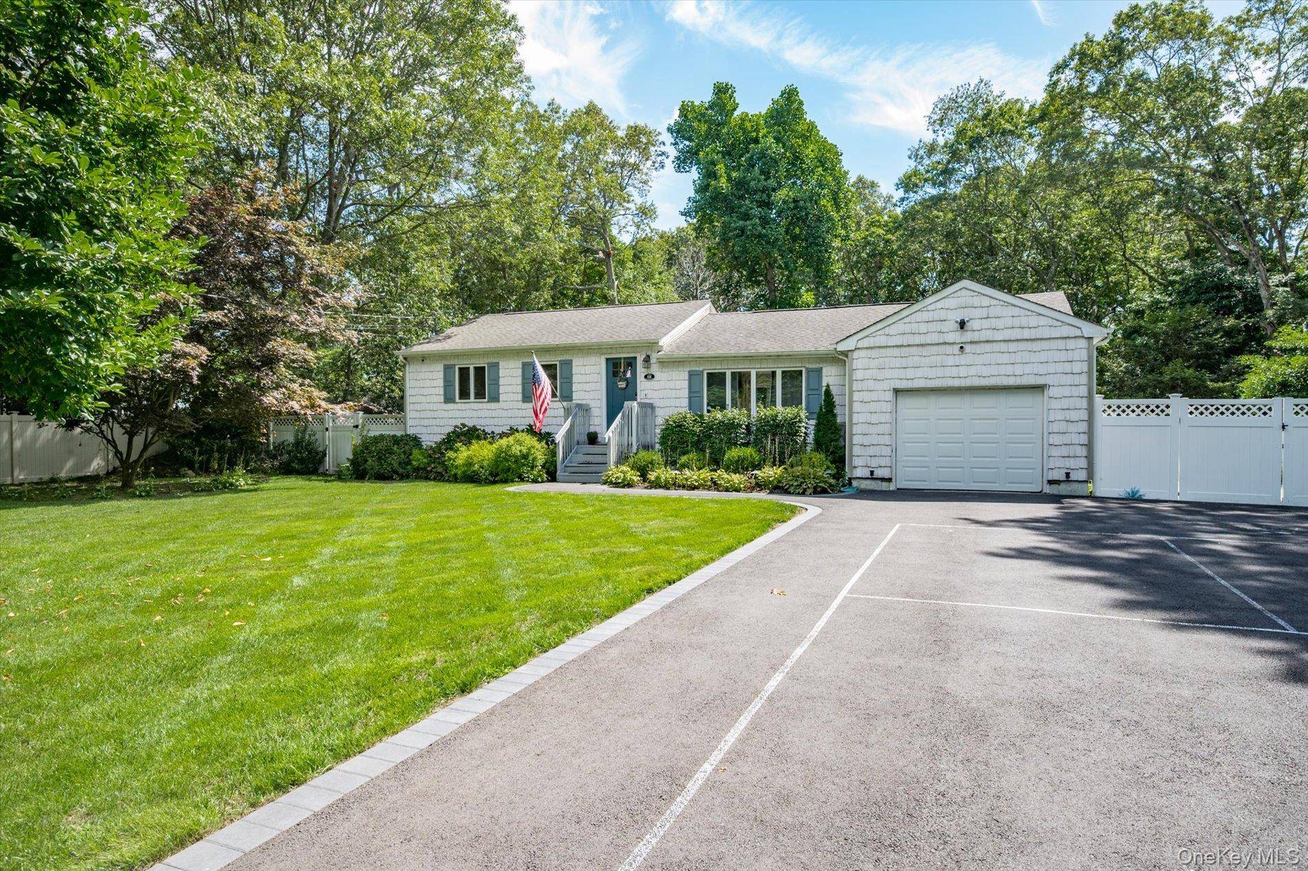 Welcome to 68 Crestwood Drive in Shirley, a beautifully maintained 3 bedroom, 2 bathroom home set back on a private half acre lot.