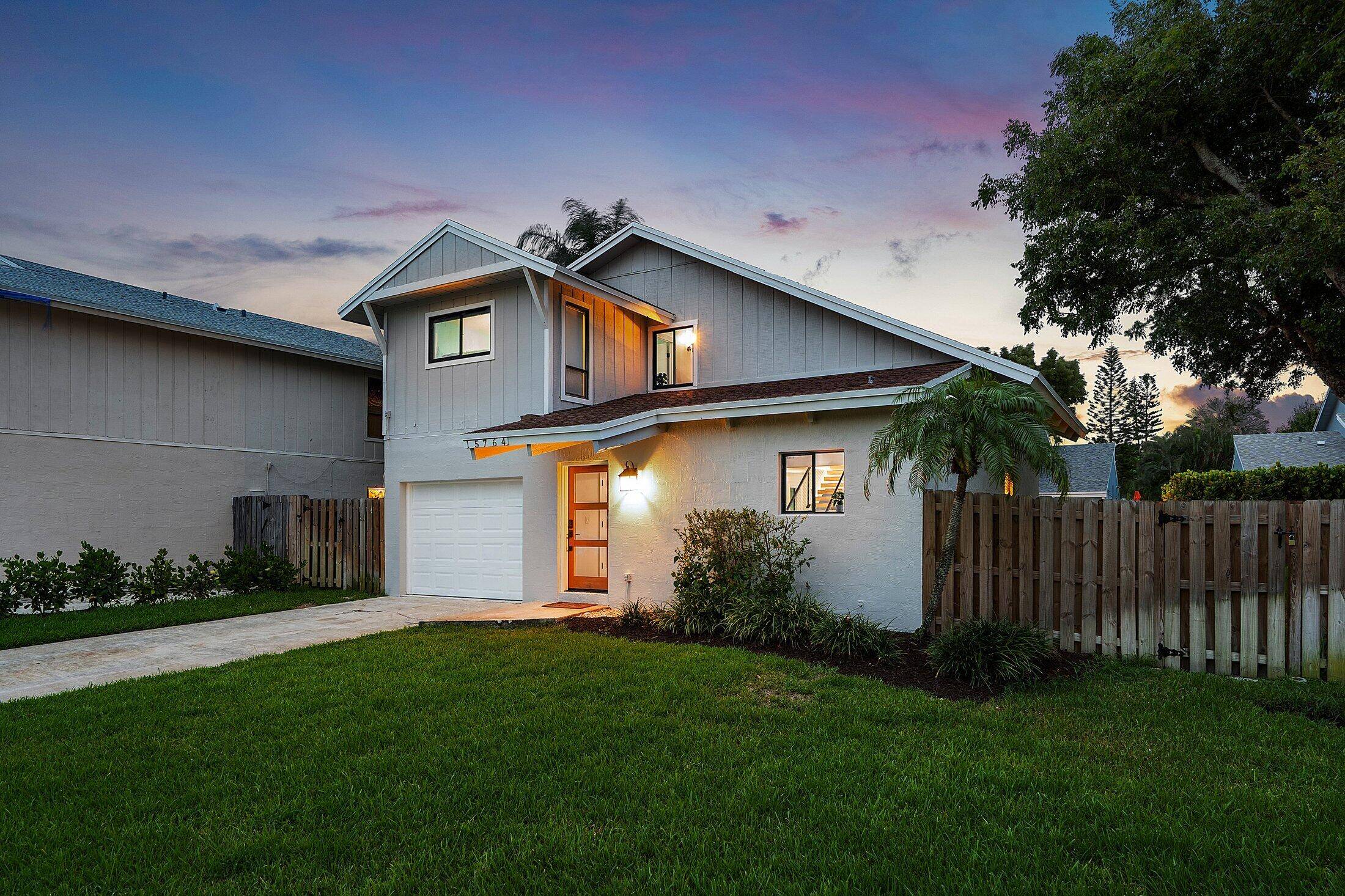 Rare opportunity to own this modern turnkey home with warm coastal vibes on a huge oversized lot near pristine Beaches of Delray Beach.