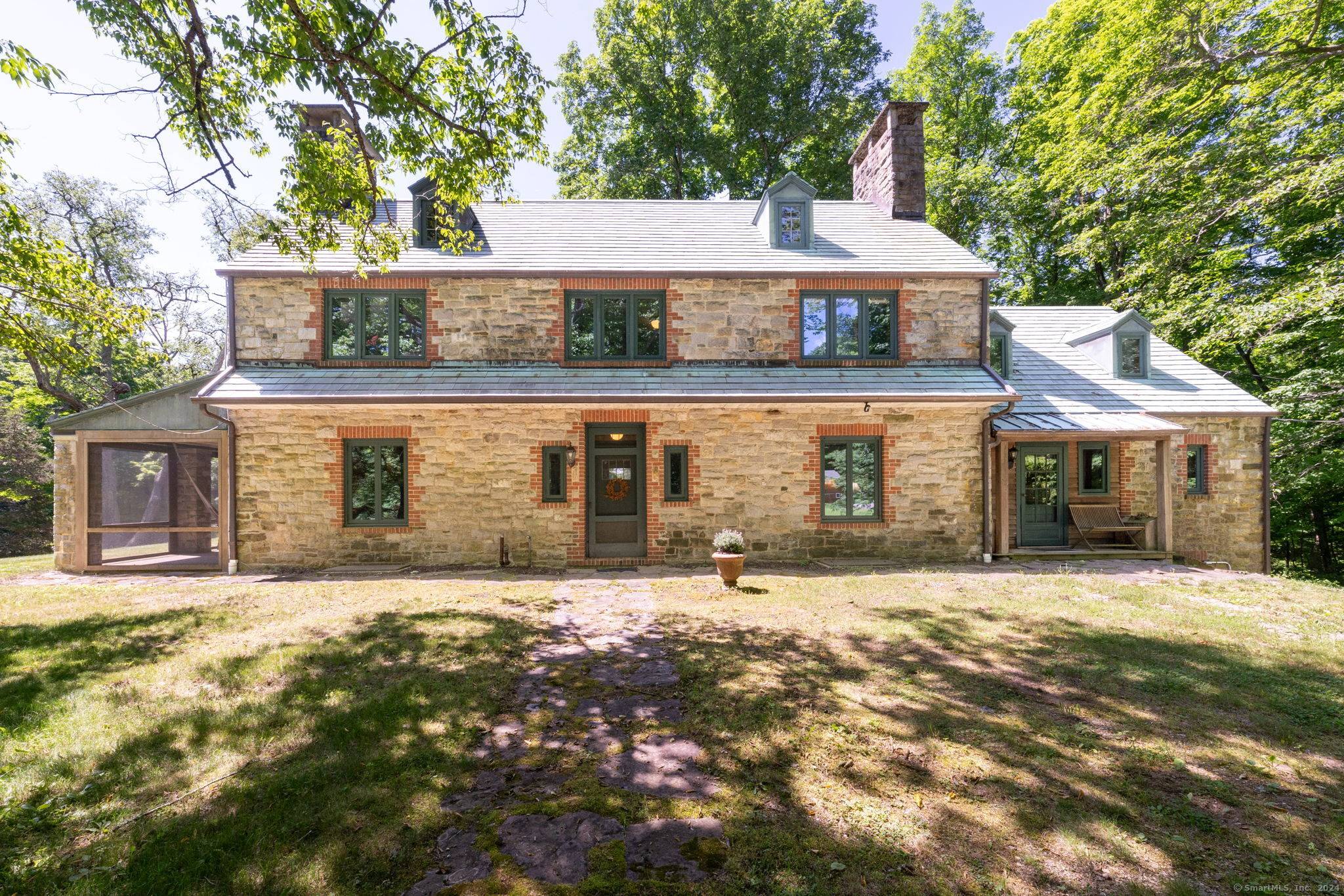 Originally designed and custom built on site with stones from property for local Doctor as a private English style hunting cottage in 1922.