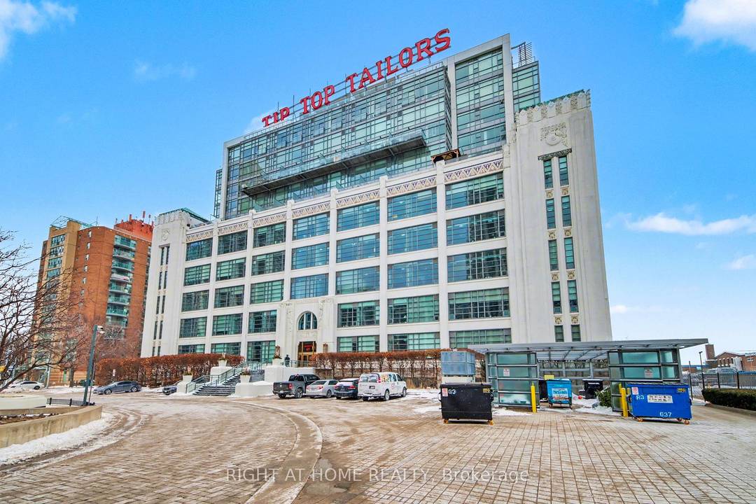 Original hard loft in the Tip Top Tailor Building featuring authentic concrete pillars and exposed concrete ceilings.
