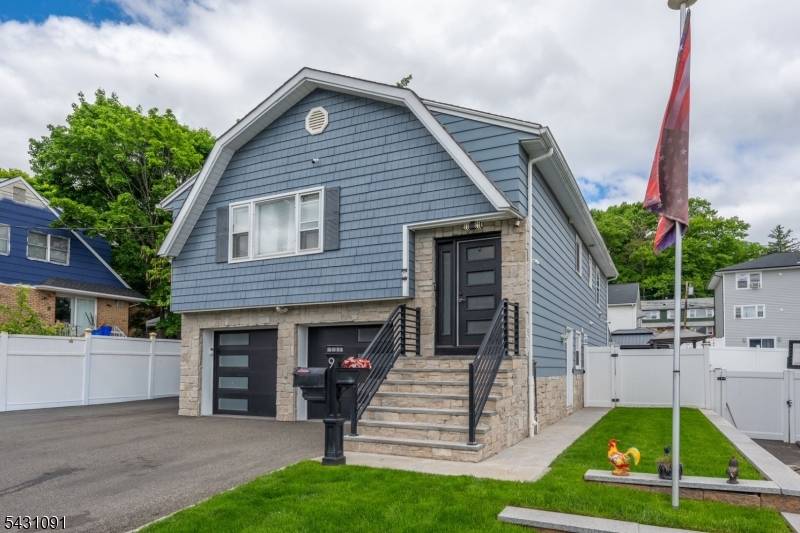 Exceptional custom renovated residence showcasing modern elegance and impressive curb appeal.