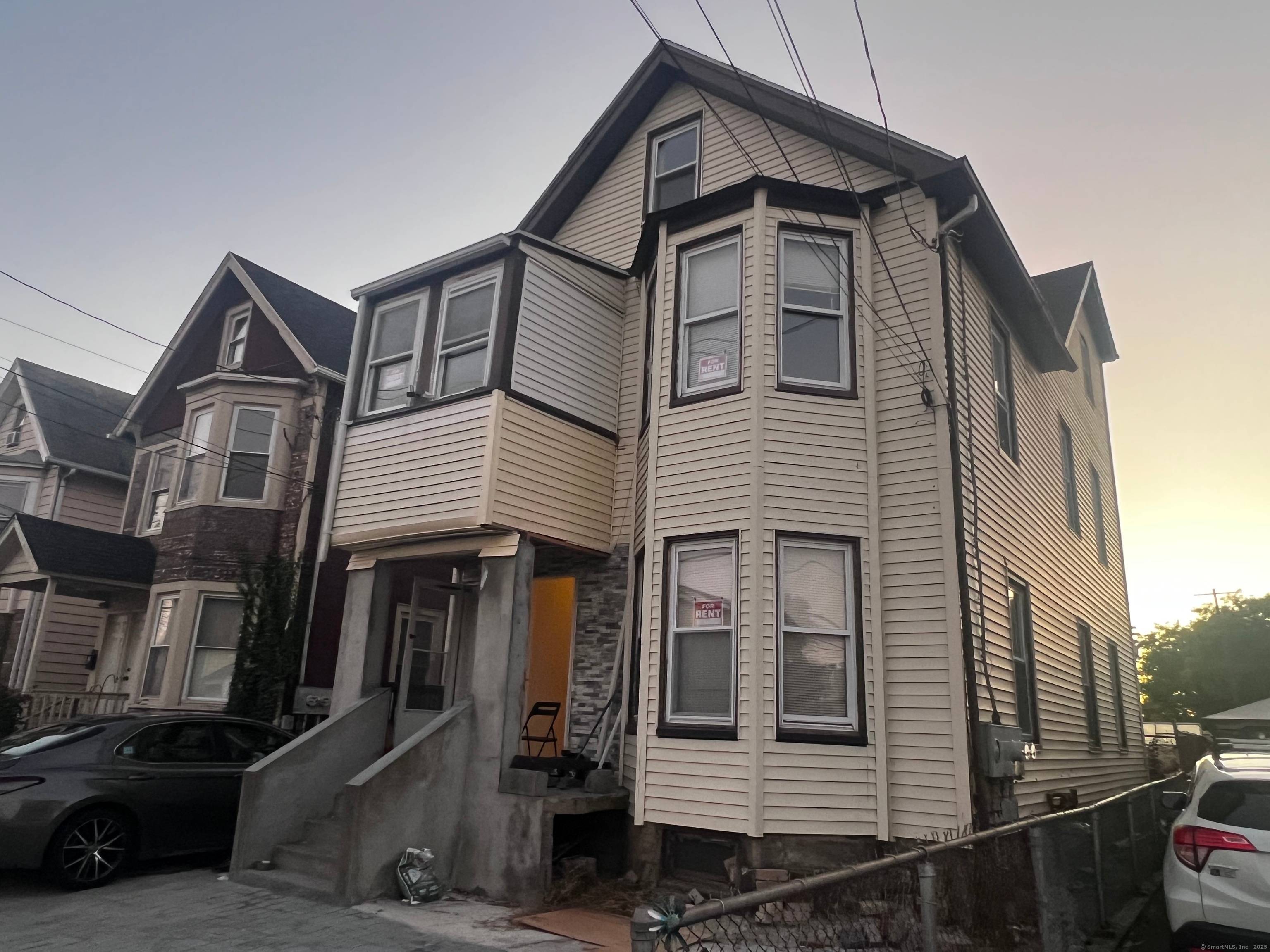 Fantastic opportunity to own this multifamily property offering two spacious units with a third floor accessory apartment !