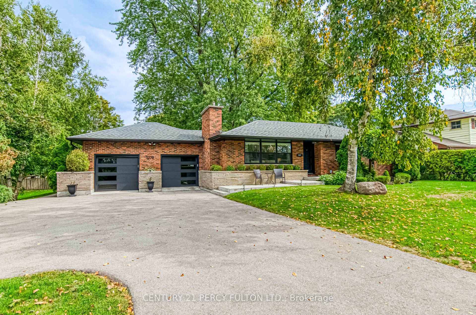 Welcome to 1270 Ontario Street in Cobourg a fabulous brick bungalow set on an exceptional double lot that feels like your own private estate.