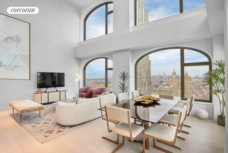 Residence 48A is a four bedroom, four and a half bathroom home featuring a dramatic double height living and dining area with ceilings approaching 19 feet, framing panoramic river and ...