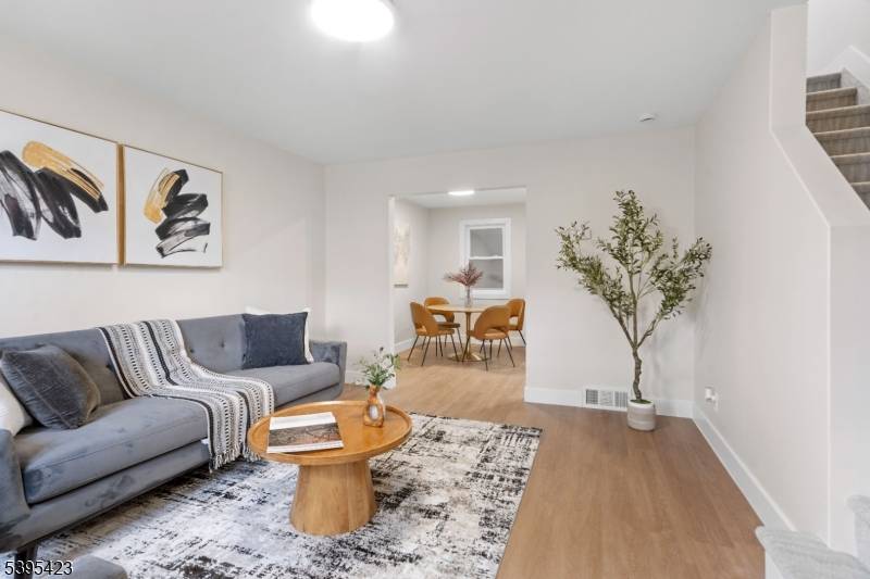 Welcome to 13 Melmore Gardens, a beautifully updated home in the vibrant community of East Orange, NJ.