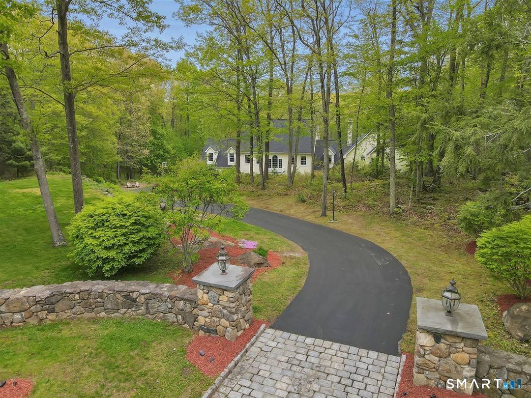 Tucked behind impressive stone pillars and surrounded by beautiful stone walls on 3 private acres in one of Marlborough's most desirable neighborhoods, this exceptional Colonial offers over 5, 300 sq.