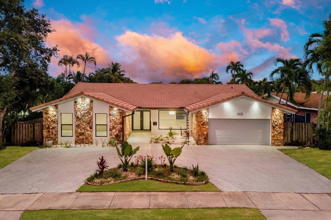 One story lakefront masterpiece in Greyknoll Estates, a highly esteemed waterfront community.