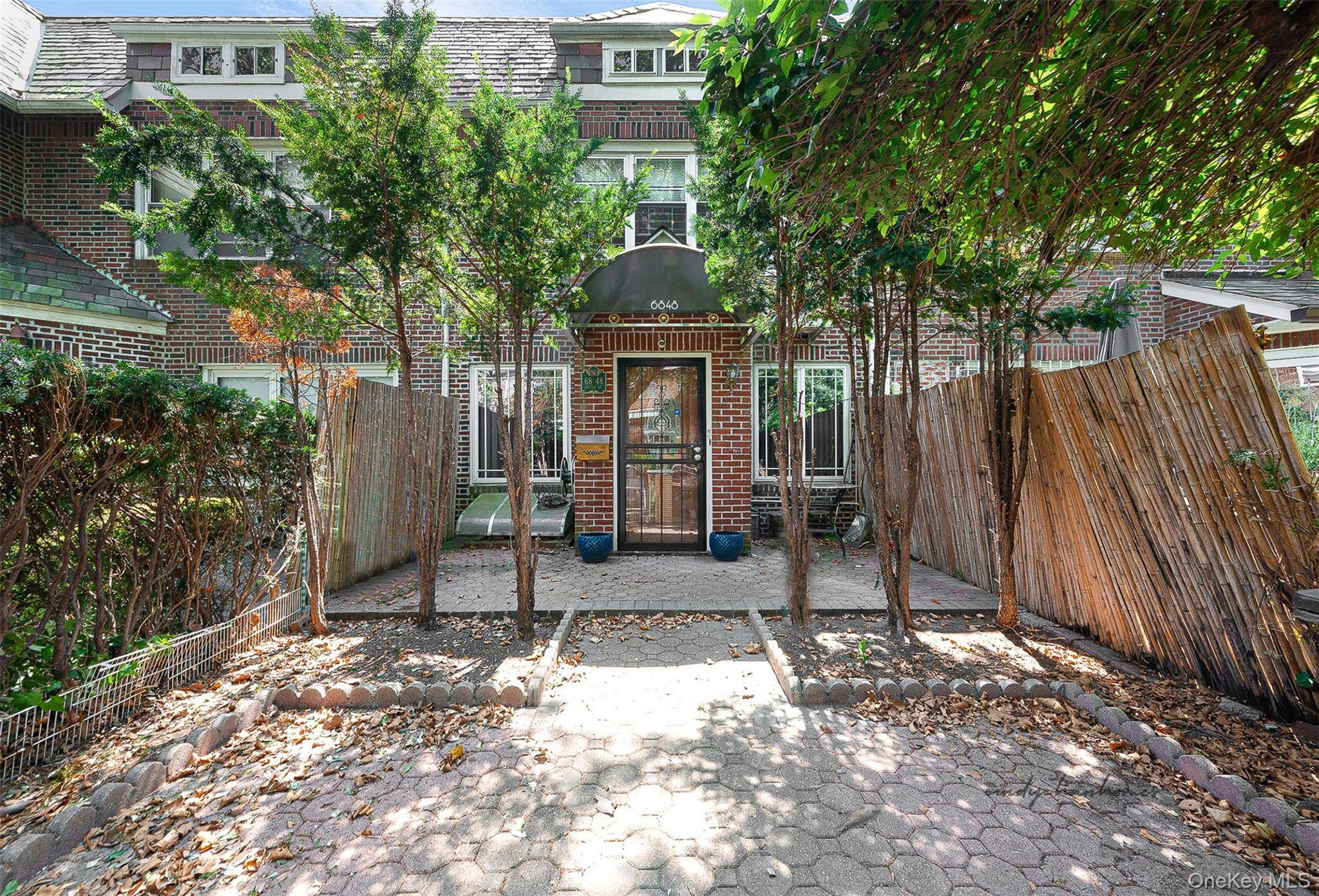 Spacious 18 foot brick townhouse for rent in prime Forest Hills location.