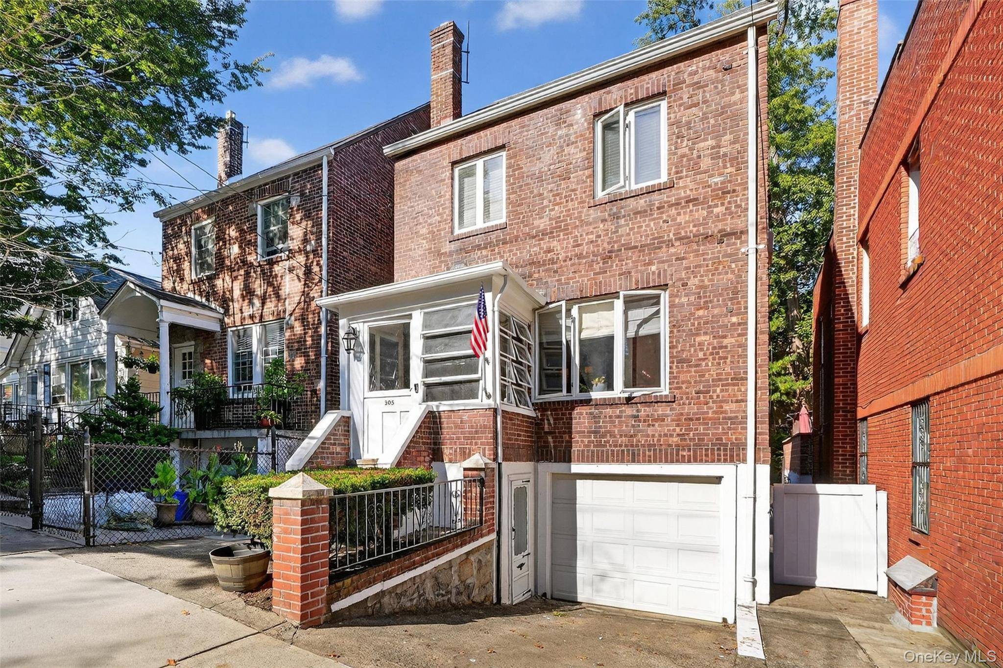 Welcome to 305 West 259th Street, a meticulously renovated brick row house that seamlessly blends historic charm with contemporary luxury.