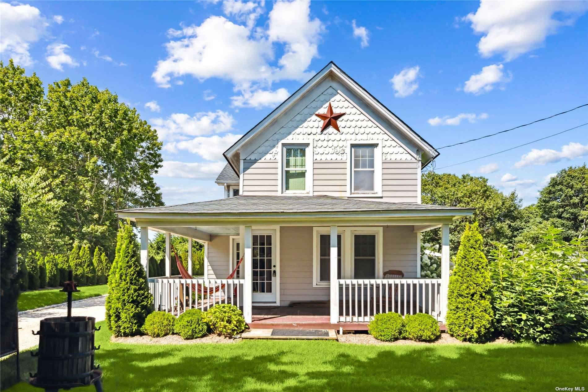 This fully renovated, Westhampton retreat is private amp ; set back from the road with custom entry gates, an expansive driveway, and luscious, mature landscaping.