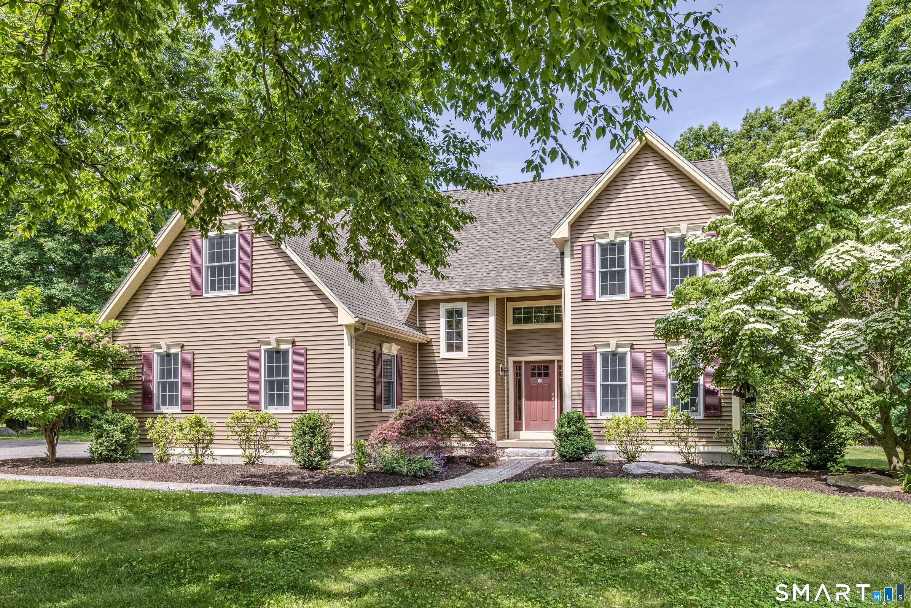 Stunning custom built Colonial offering exceptional craftsmanship, thoughtful design, and modern conveniences throughout.