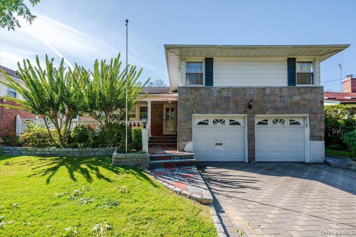 Beautiful brick and stone split level home in the heart of Oakland Gardens.