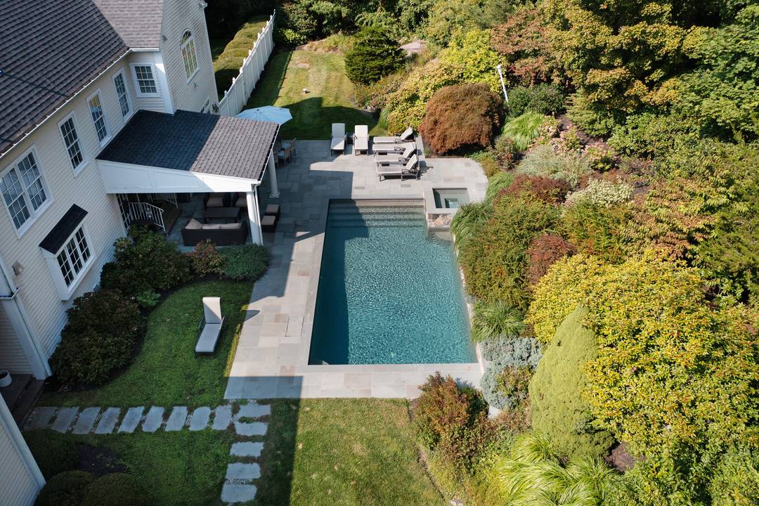 Welcome Home to this absolutely stunning Richard Ramey built residence beautifully sited on 2 lushly landscaped acres in prime South Ridgefield !