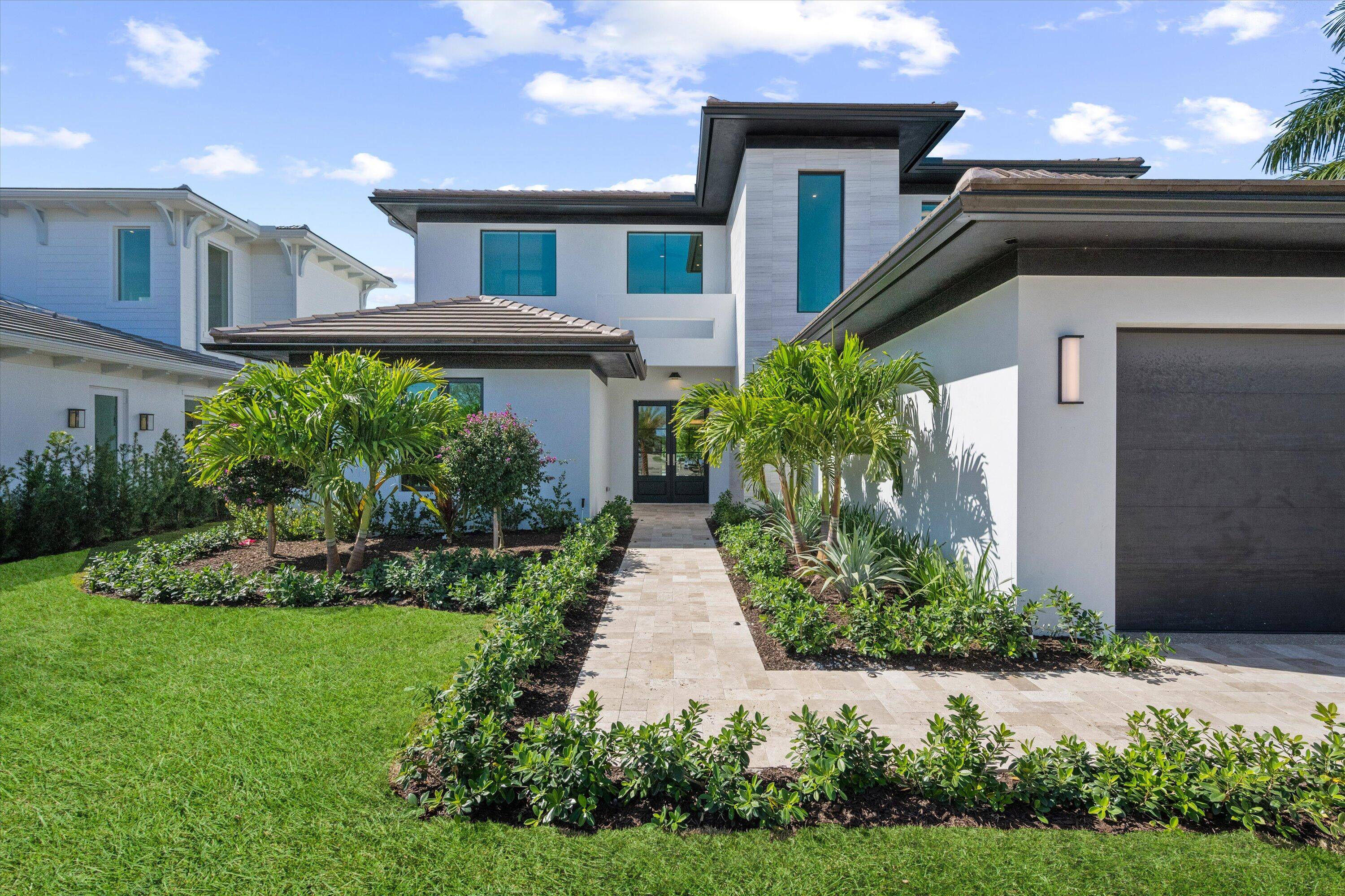 Experience luxury living redefined in this custom built estate nestled within the exclusive Palm Beach Polo community.