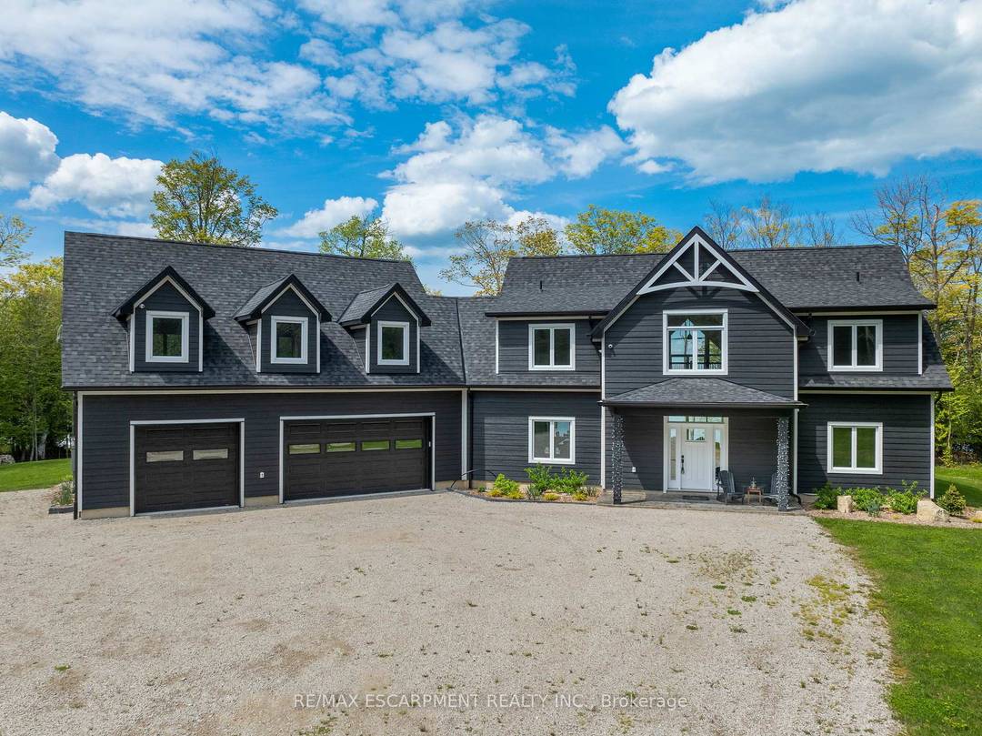 Stunning Custom Built Lakefront Retreat on Lake Manitou Welcome to 76 Johnston Road, a breathtaking custom built lakefront home completed in 2022.