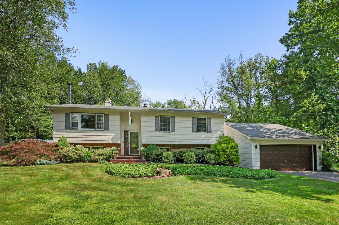 Charming Updated Raised Ranch with Outdoor Oasis.