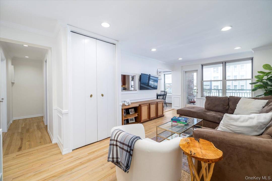 Welcome to your Long Beach dream home a rare corner unit retreat where light pours in from every angle and indoor elegance flows seamlessly outdoors.