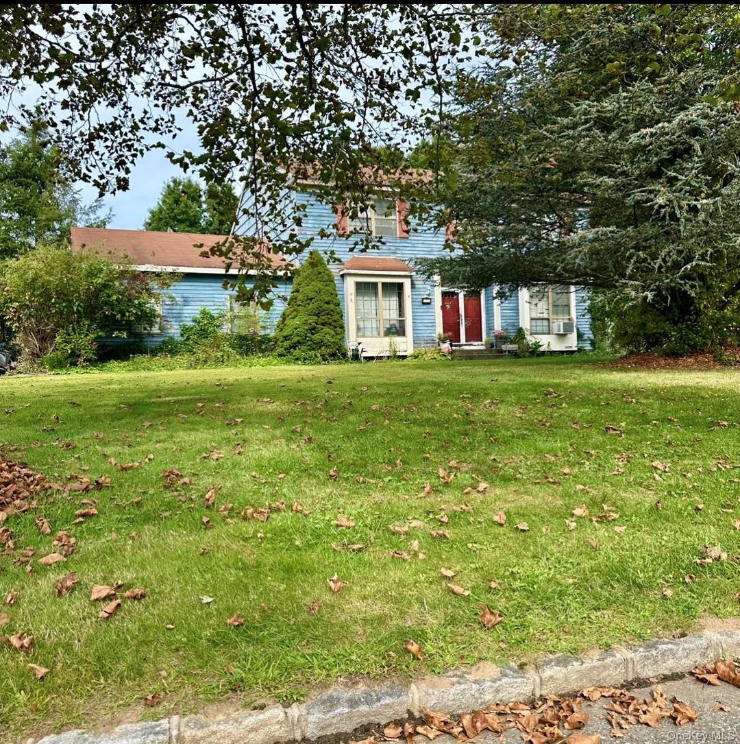 This classic Colonial offers a generous layout with four generously sized bedrooms and three full bathrooms, providing plenty of space for comfortable living.