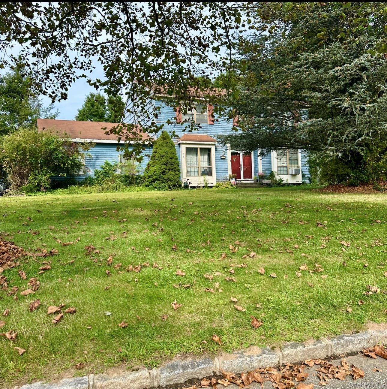 This classic Colonial offers a generous layout with four bedrooms and three full bathrooms, providing plenty of space for comfortable living.