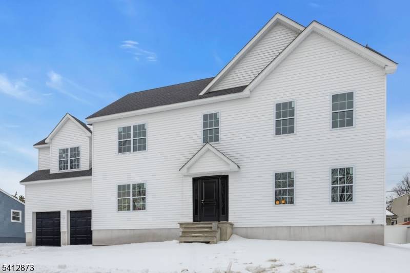 Stunning brand new construction in Woodbridge Township featuring 4 bedrooms, 3 baths, and a two car garage.