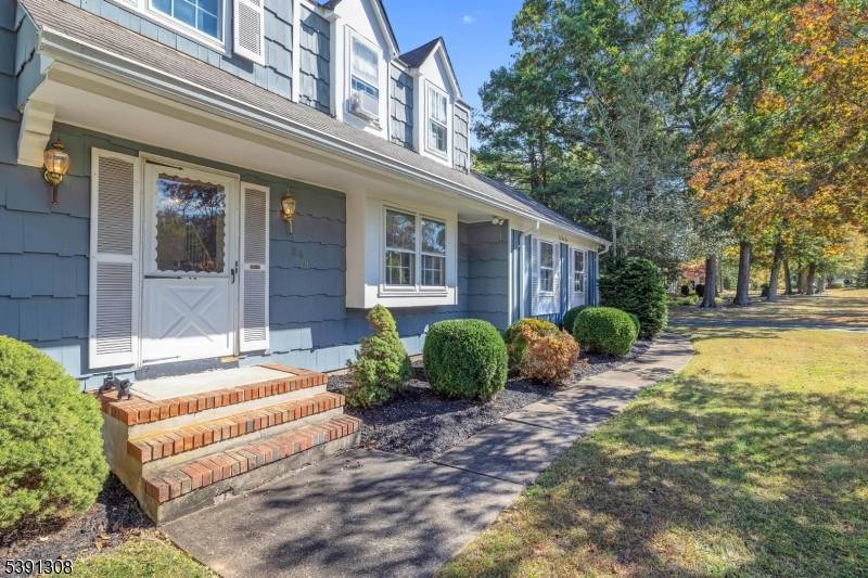 Set on over an acre of scenic property, this spacious 4 bedroom, 2.