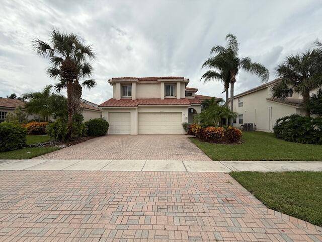 SPACIOUS 5 3 WITH 3 CAR GARAGE ON THE LAKE, ACCORDION SHUTTERS, NEW STAINLESS STEEL APPLIANCES, GREAT LOCATION.