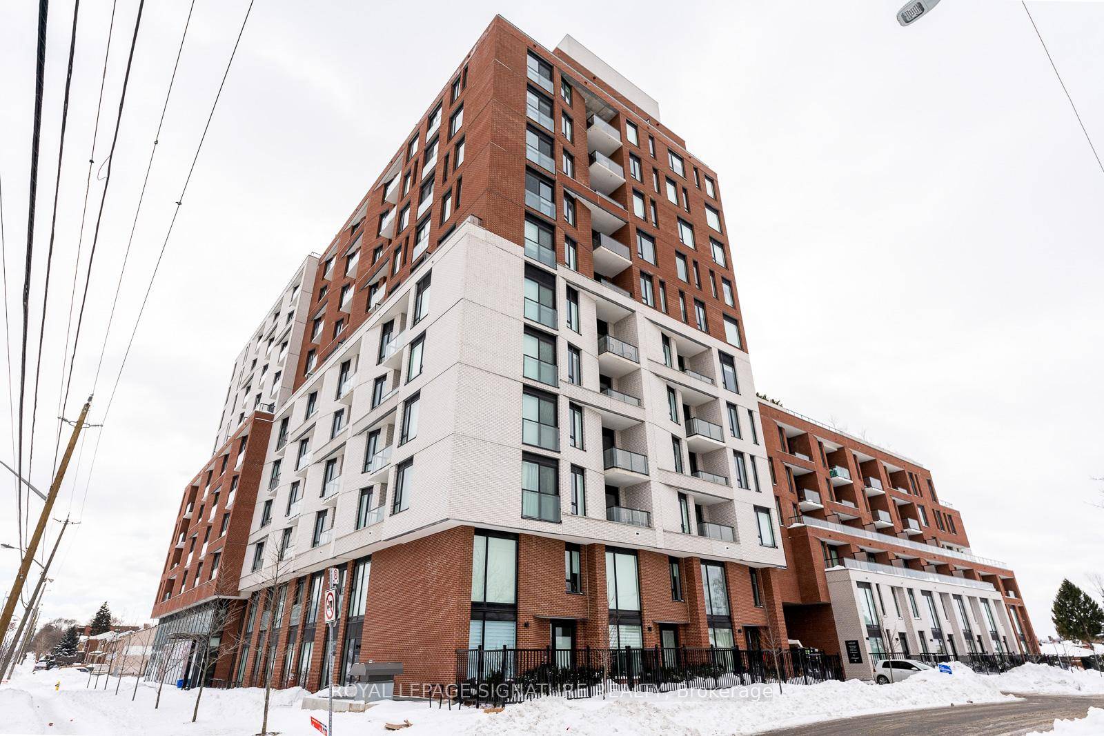 Bathed in sunlight streaming through expansive windows, this one bedroom corner unit at The Keeley Condos offers a tranquil oasis overlooking a serene pond.
