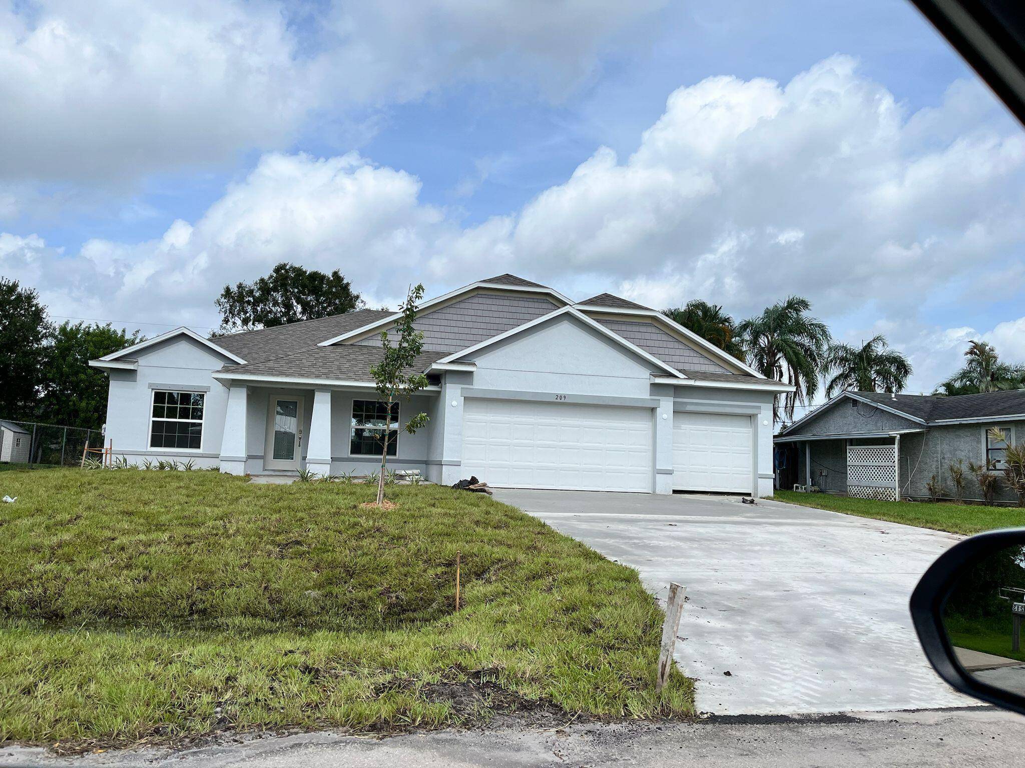 Welcome to your next home a spacious four bedroom plus Den that could easily be used as an additional bedroom, three bathroom dream home nestled in a peaceful Port St.