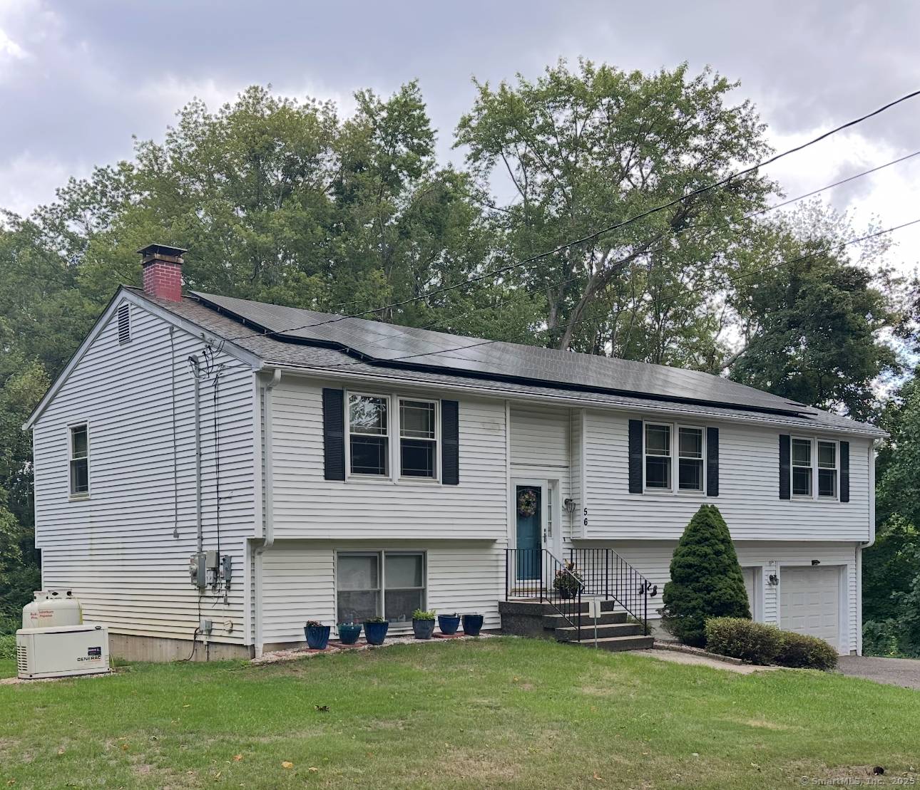 Welcome to this beautifully maintained raised ranch, perfectly situated on over an acre in the serene Great Hill neighborhood.