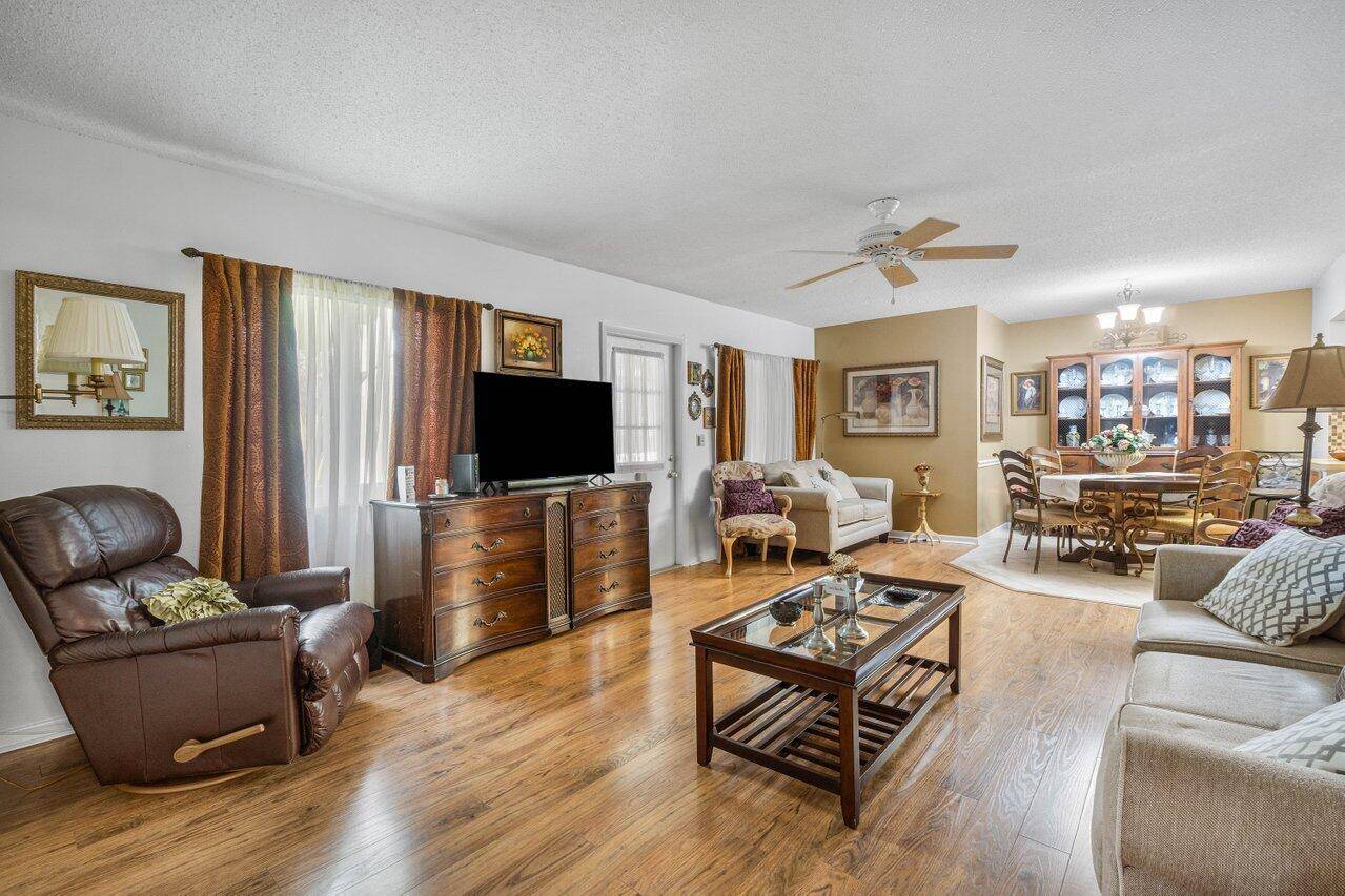 Charming first floor condo nestled in lush tropical surroundings !