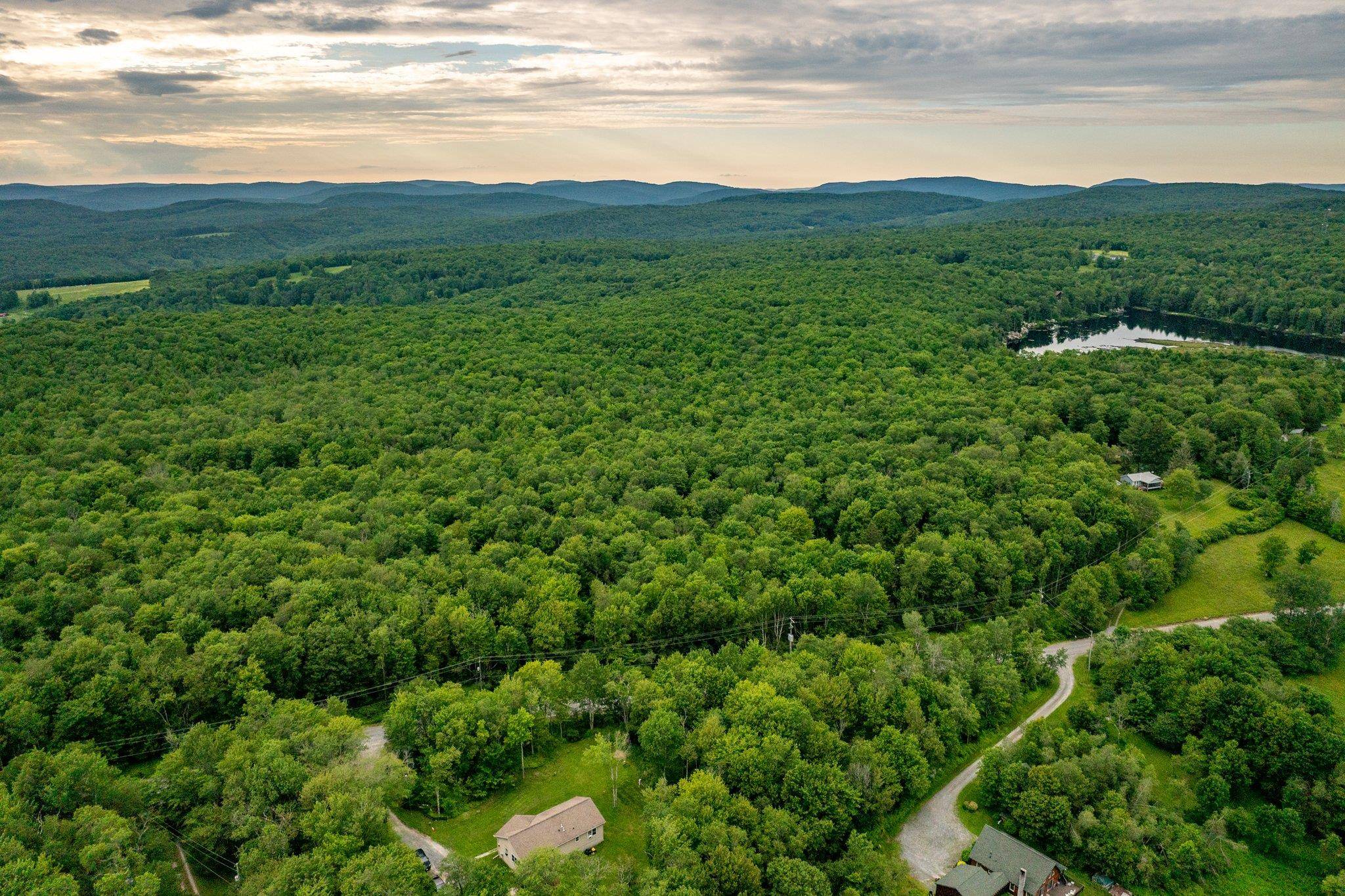Nestled in Livingston Manor, New York, this expansive 102 acre parcel with 380 feet of frontage offers the perfect blend of tranquility and convenience.