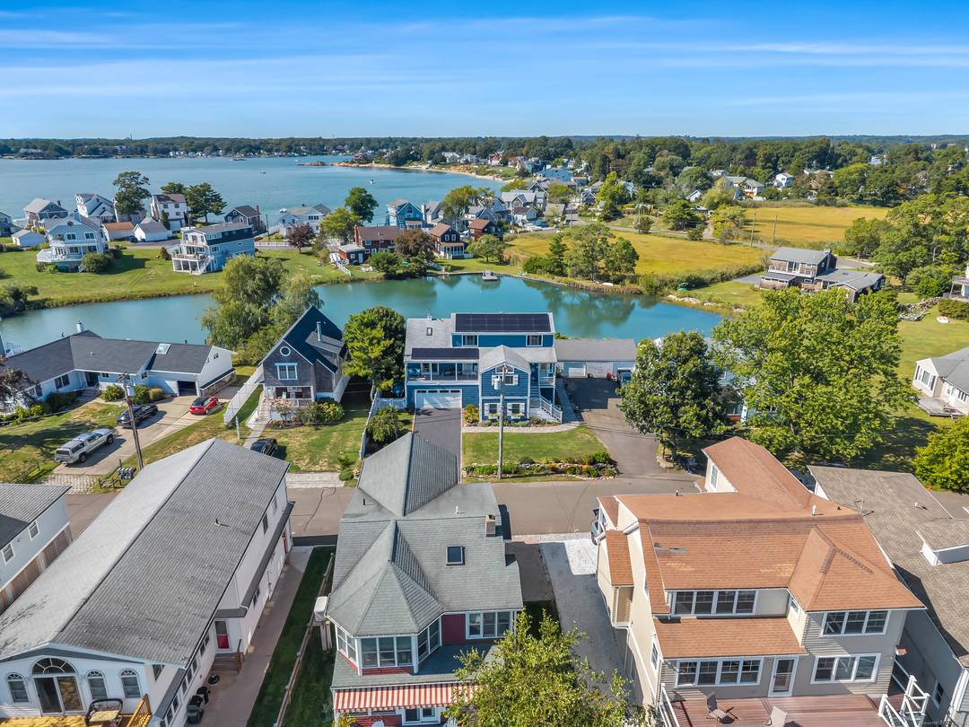 Welcome to your dream waterfront retreat on Summer Island, a sought after beach community in Indian Neck, Branford.