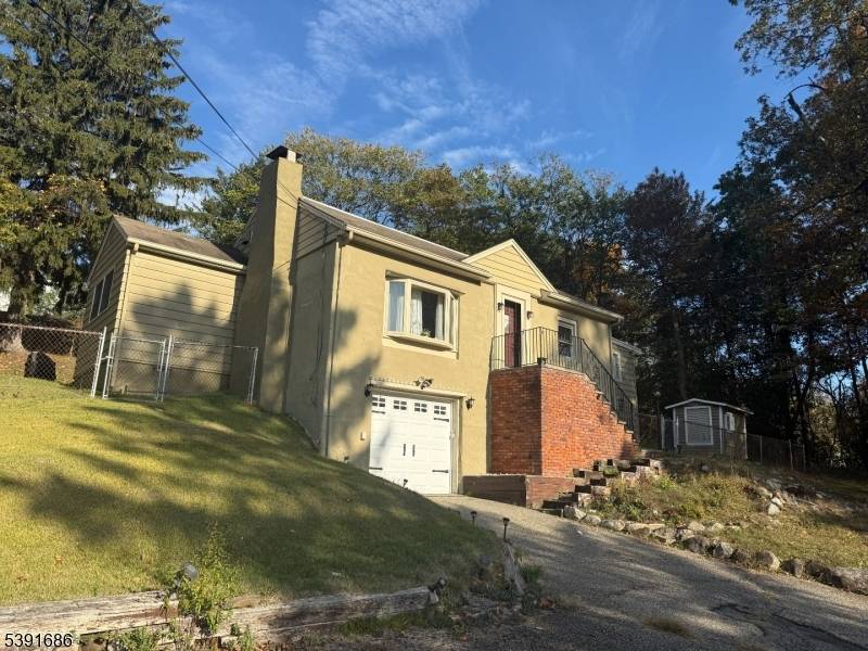 Welcome to this charming home perched on high ground with a beautiful and calming view of Farms View Garden !