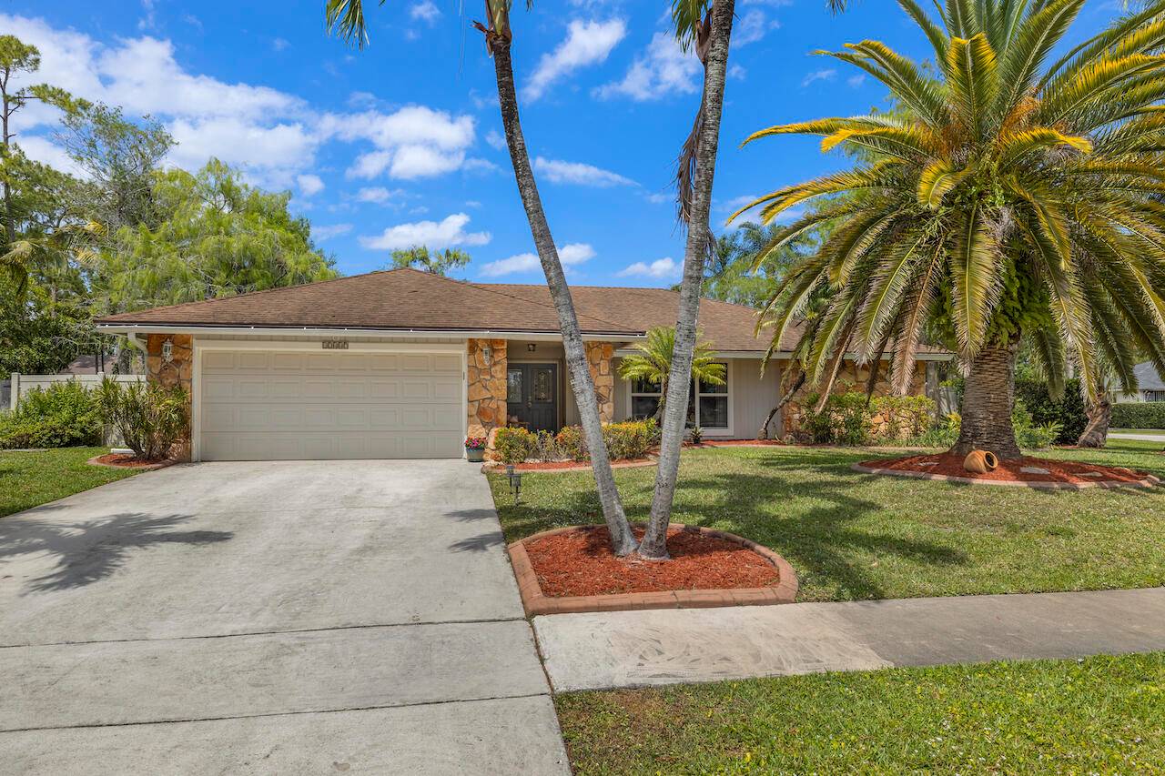 Gorgeous home situated on a huge oversized corner lot with privacy fence and mature fruit trees including banana, papaya, guava, mulberry and cherry trees.