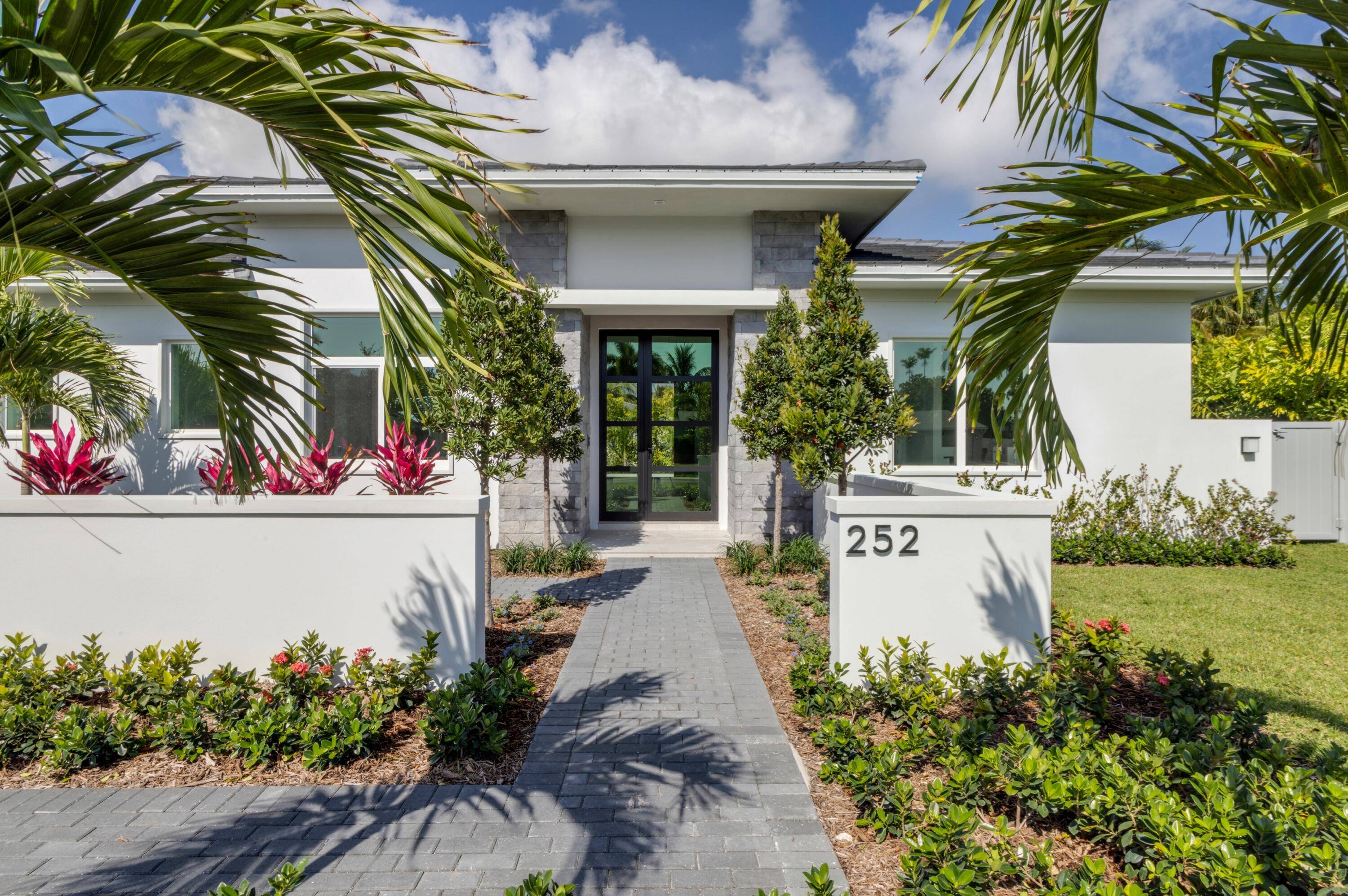 New construction Coastal Contemporary masterpiece designed by Gary Eliopoulos and built by Seaside Builders, features open floorplan, split layout, with banks of sliding doors in all major rooms opening to ...