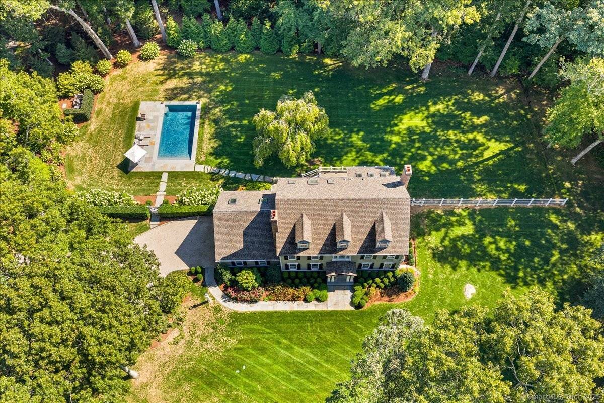 A traditional Colonial set on a quiet, tree lined street, completely updated and refreshed with understated elegance throughout.