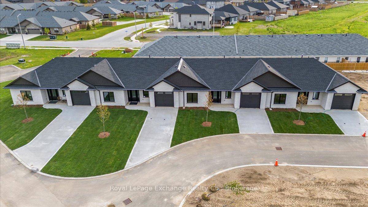 Welcome to the epitome of modern living in this stunning luxury bungalow 2 bedroom 2 bath townhouse interior unit with almost 1400 sq.