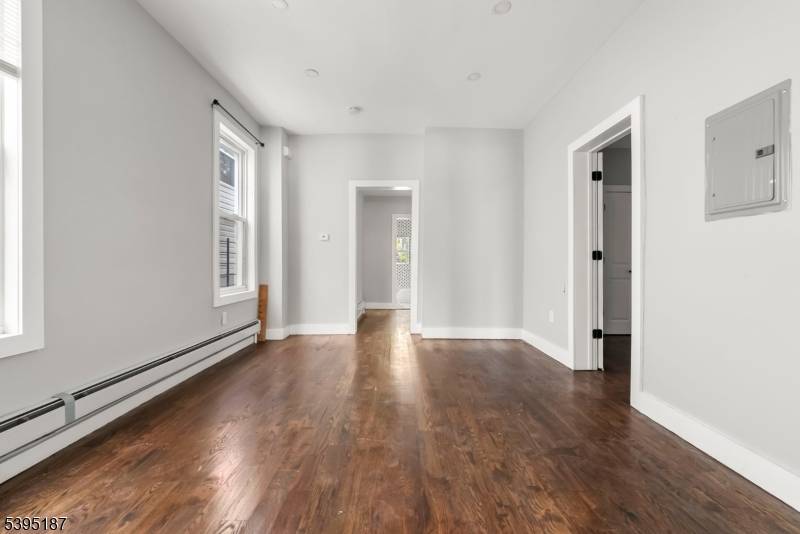 Welcome to 119 Littleton Ave, a stunning 3 family property completely renovated in 2022 !