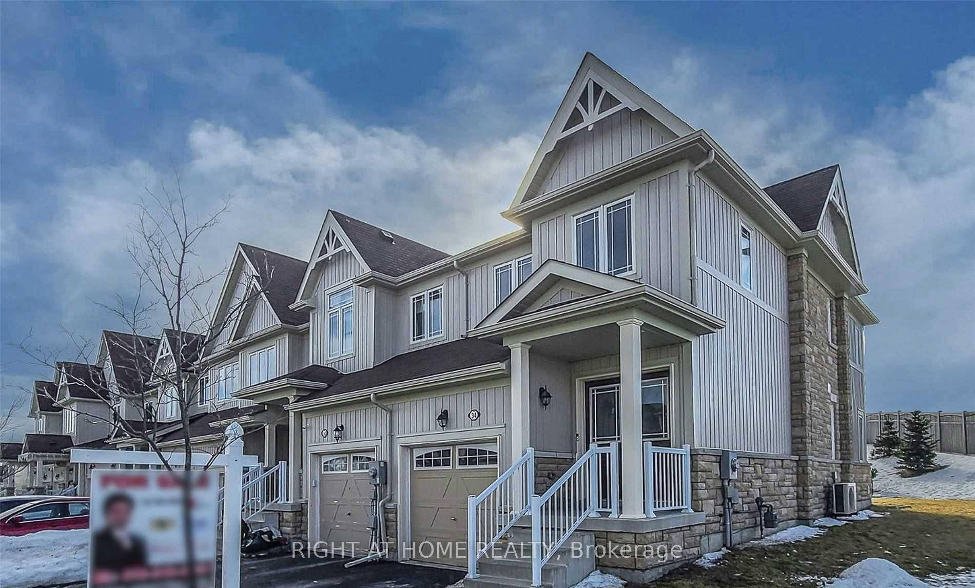 Stylish and spacious executive end unit townhome in a sought after family friendly community.