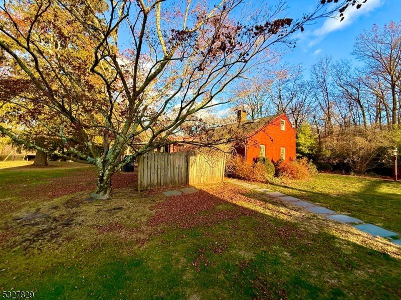 CHARMING COUNTRY COTTAGE NESTLED ON ALMOST 3 4 0F AN ACRE.