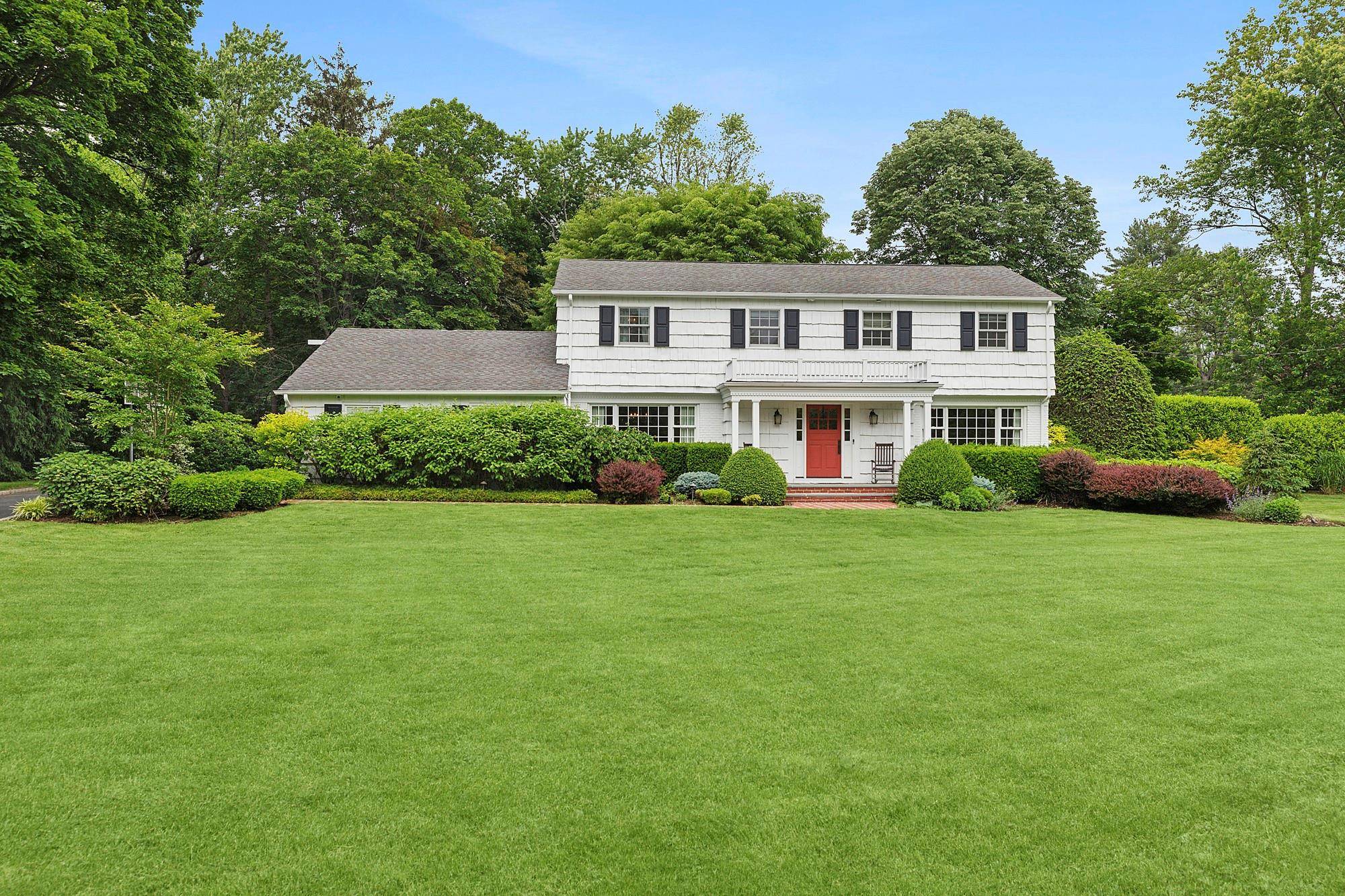 Located in the Incorporated Village of Muttontown and within the Syosset School District, this updated Center Hall Colonial sits on a flat, private 1 acre lot.