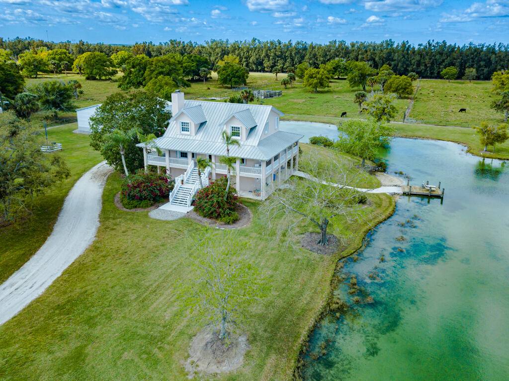 Escape to nearly 37 acres of peaceful Florida countryside where elegance meets nature.