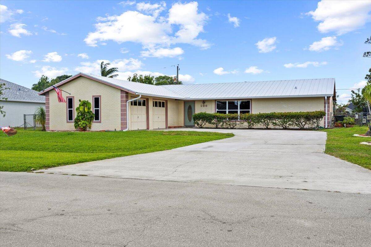 Fabulous Pool Home in PSL has 3 Bedrooms, 2 Baths, Den or Office space with storage 2 Car Garage.